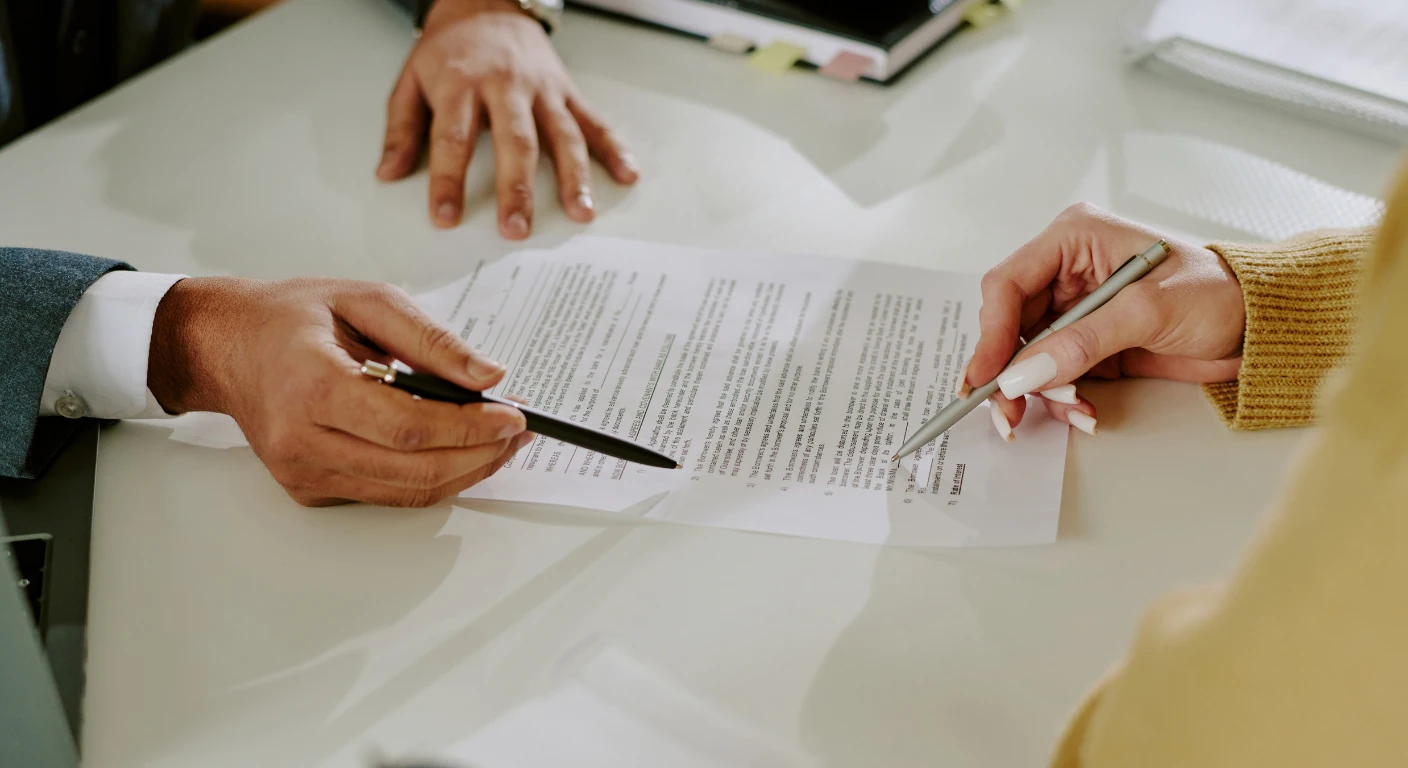 Business professionals reviewing official turkish chamber of commerce registration paperwork in an office